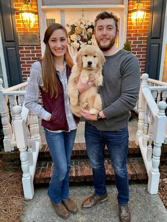 Taylor with her husband and dog