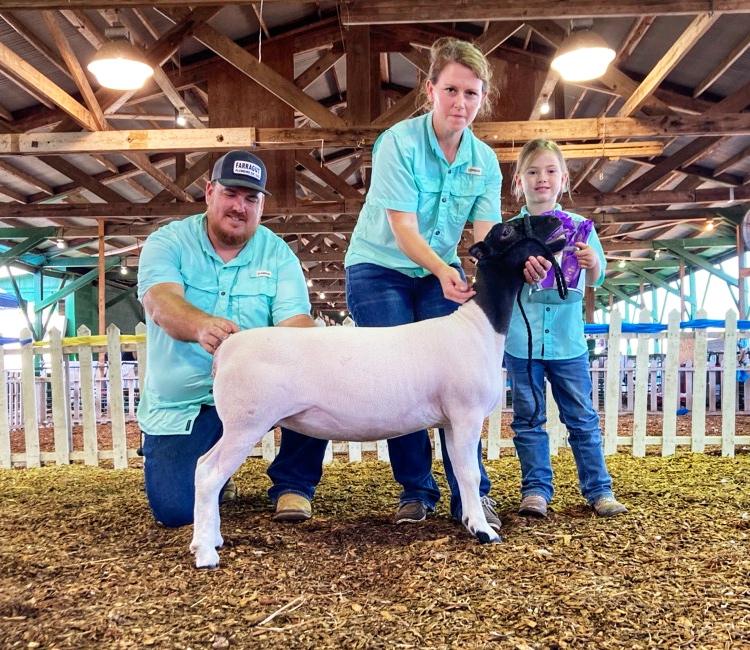 Jessy and her family with a sheep