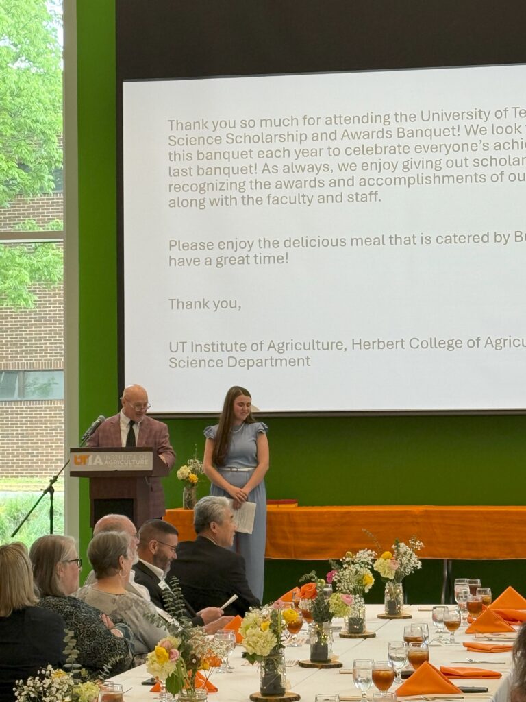 Dr. Schrick and student giving opening statements for the banquet.